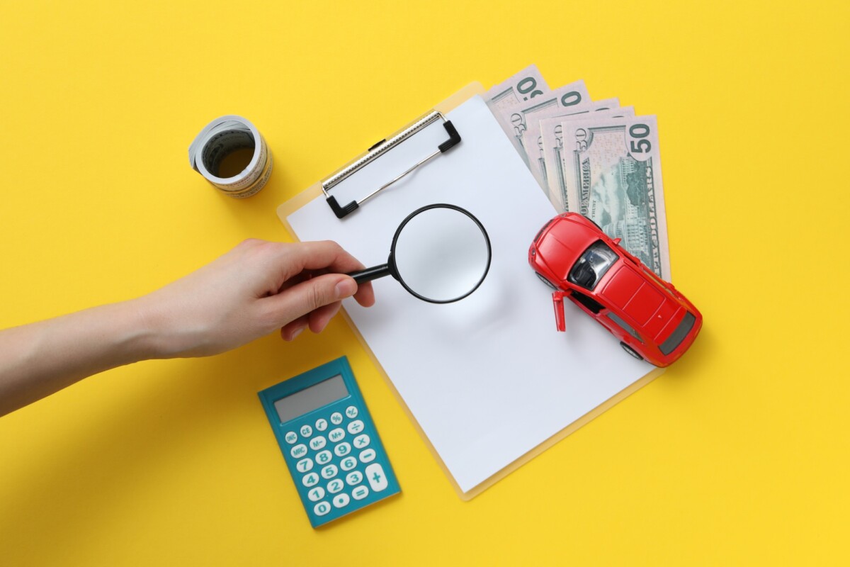 Concept of car purchase and insurance with toy car